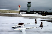 Global Flyer on snow covered runway.